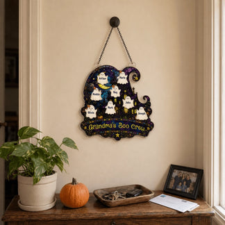 Personalized Grandma's Boo Crew wall plaque with ghost names, styled on an entryway table for Halloween home decor.