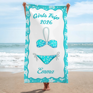 A personalized beach towel for a 2026 girls trip featuring a bikini design and the name Emma in a teal coastal frame.