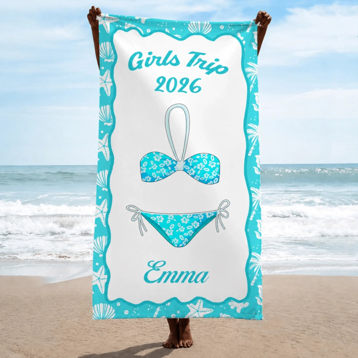 A personalized beach towel for a 2026 girls trip featuring a bikini design and the name Emma in a teal coastal frame.