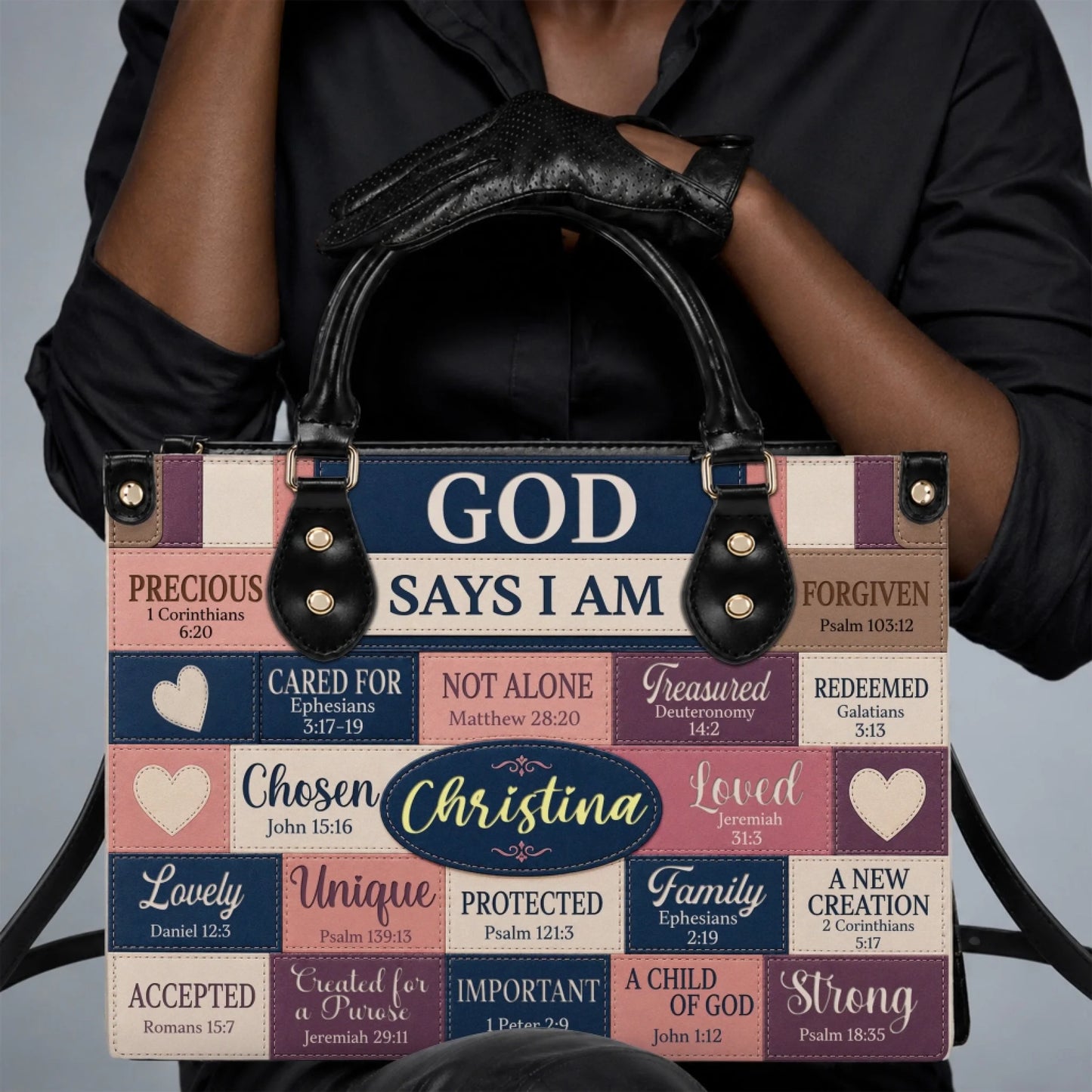A woman holding a personalized PU leather handbag featuring God Says I Am scripture quotes and the name Christina.