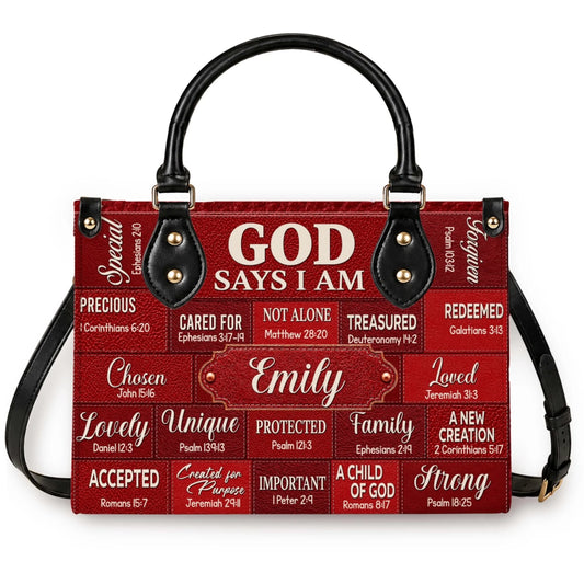 A personalized red leather handbag featuring inspirational scripture verses and the custom name Emily in a block design.