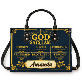 A navy blue PU leather handbag featuring a personalized God Says I Am design with Bible verses and the name Amanda.