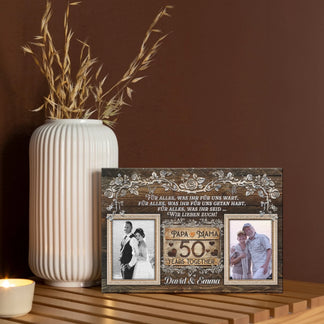 Custom 50th wedding anniversary canvas decor featuring floral details, two photos, and names for a romantic gift.
