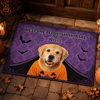 Custom halloween doormat featuring a golden retriever in a pumpkin shirt with the phrase Welcome Foolish Mortals Wrens.