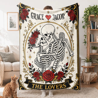 Gothic style tarot card fleece blanket displaying a skeleton couple with red flowers and custom Grace Jacob lettering.