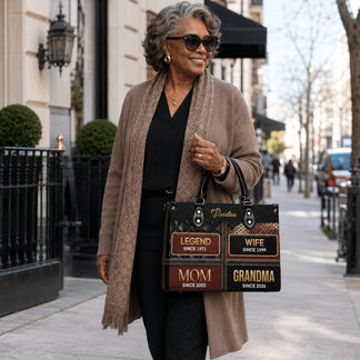 Stylish woman carrying a personalized grandma handbag featuring milestone years, an ideal sentimental Mother Day gift idea.