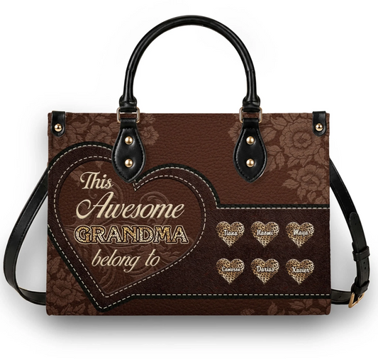 Brown floral leather handbag with custom heart names and This Awesome Grandma belong to text for a thoughtful gift.