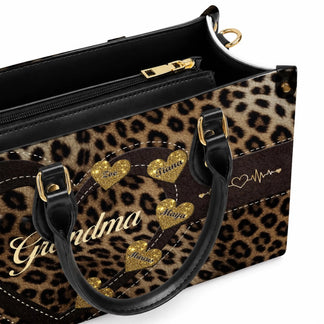 Personalized leopard print handbag for grandma featuring custom names on gold hearts and a heart heartbeat design.