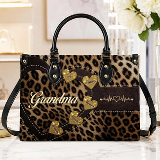 Elegant leopard print purse for grandma featuring personalized glitter hearts with names and heartbeat motifs.