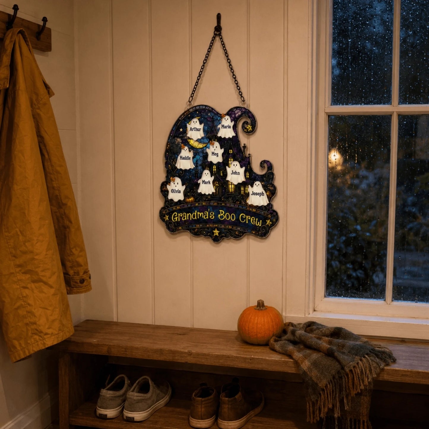 A personalized Halloween ghost wall decor sign labeled Grandma's Boo Crew hanging in a rustic entryway.