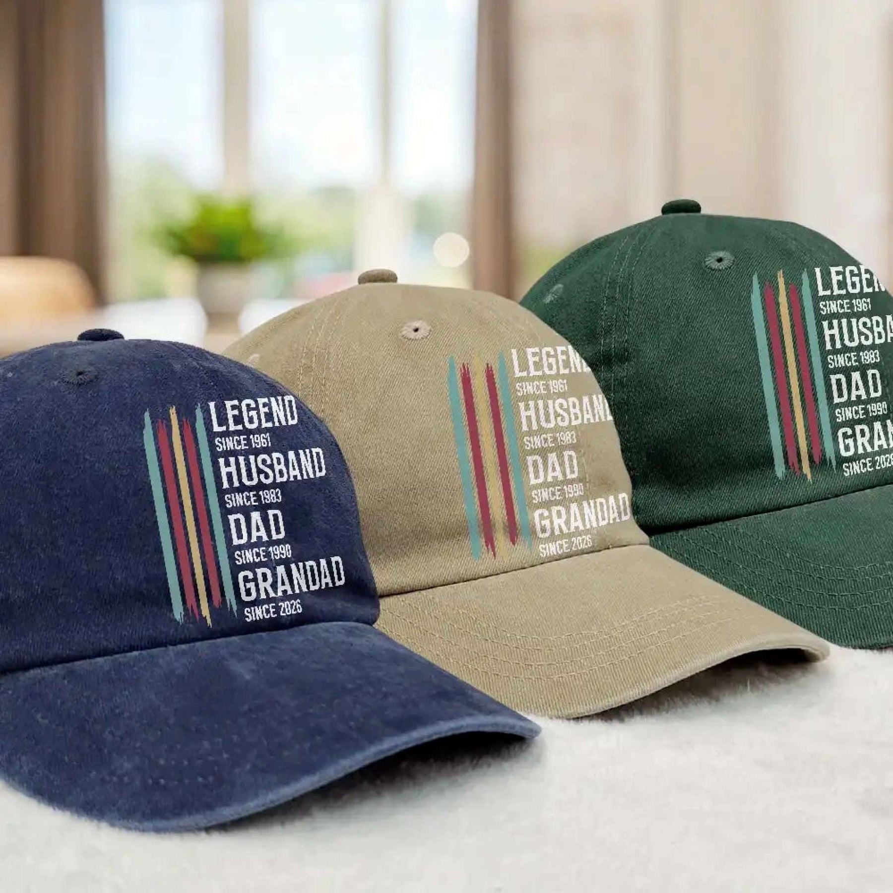 Three baseball caps with text on a blurred indoor background