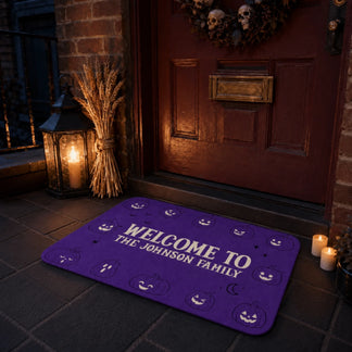 Spooky purple halloween doormat featuring custom johnson family text and smiling pumpkins for porch decoration