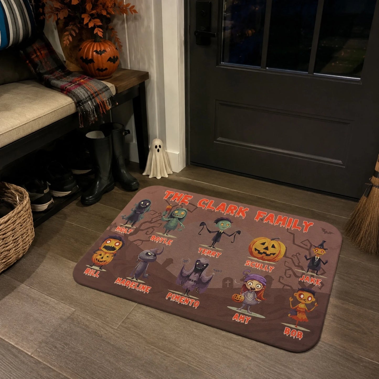 A personalized Halloween doormat featuring spooky cartoon characters and custom names for The Clark Family house decor.