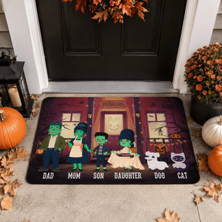 A personalized Halloween doormat featuring a cute monster family illustration with labels for Dad Mom Son Daughter Dog and Cat.