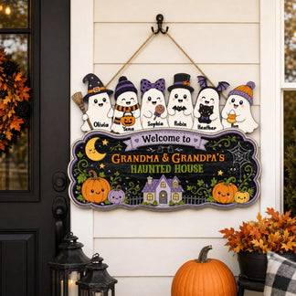Custom Grandma and Grandpa's Haunted House wooden sign hanging on a door, featuring six adorable personalized ghosts.