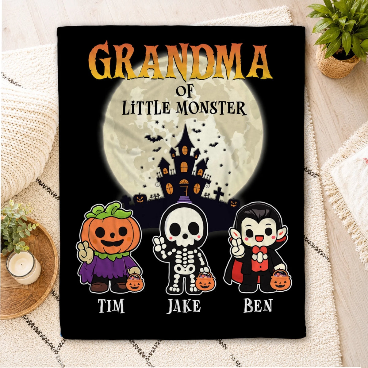 Personalized Halloween blanket for Grandma featuring a spooky haunted house and three cute little monsters named Tim Jake and Ben.