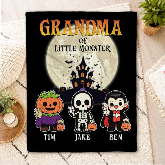 Personalized Halloween blanket for Grandma featuring a spooky haunted house and three cute little monsters named Tim Jake and Ben.