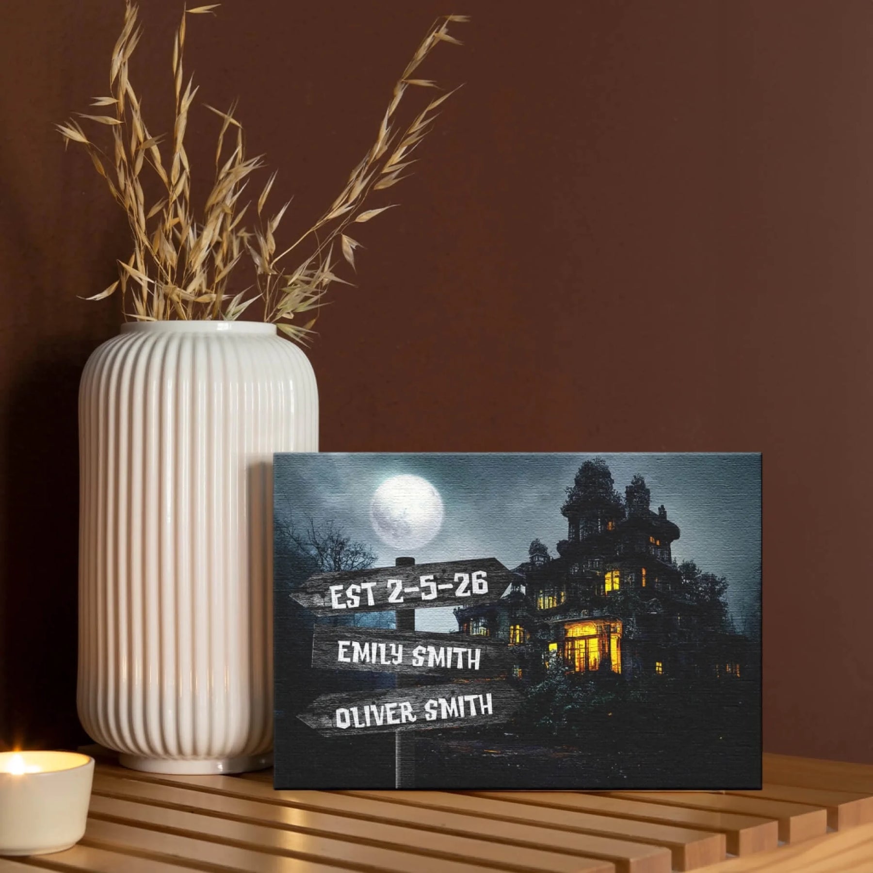 Personalized haunted house canvas featuring custom names and date, perfect as a spooky Halloween home decor gift.