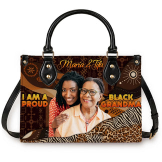 Custom photo and name handbag featuring I am a proud black grandma text on a patterned brown African tribal background.