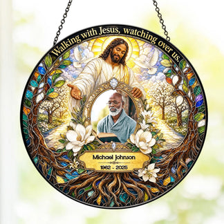 A round acrylic suncatcher for memorials with a custom photo, name, and dates alongside a religious Jesus illustration.