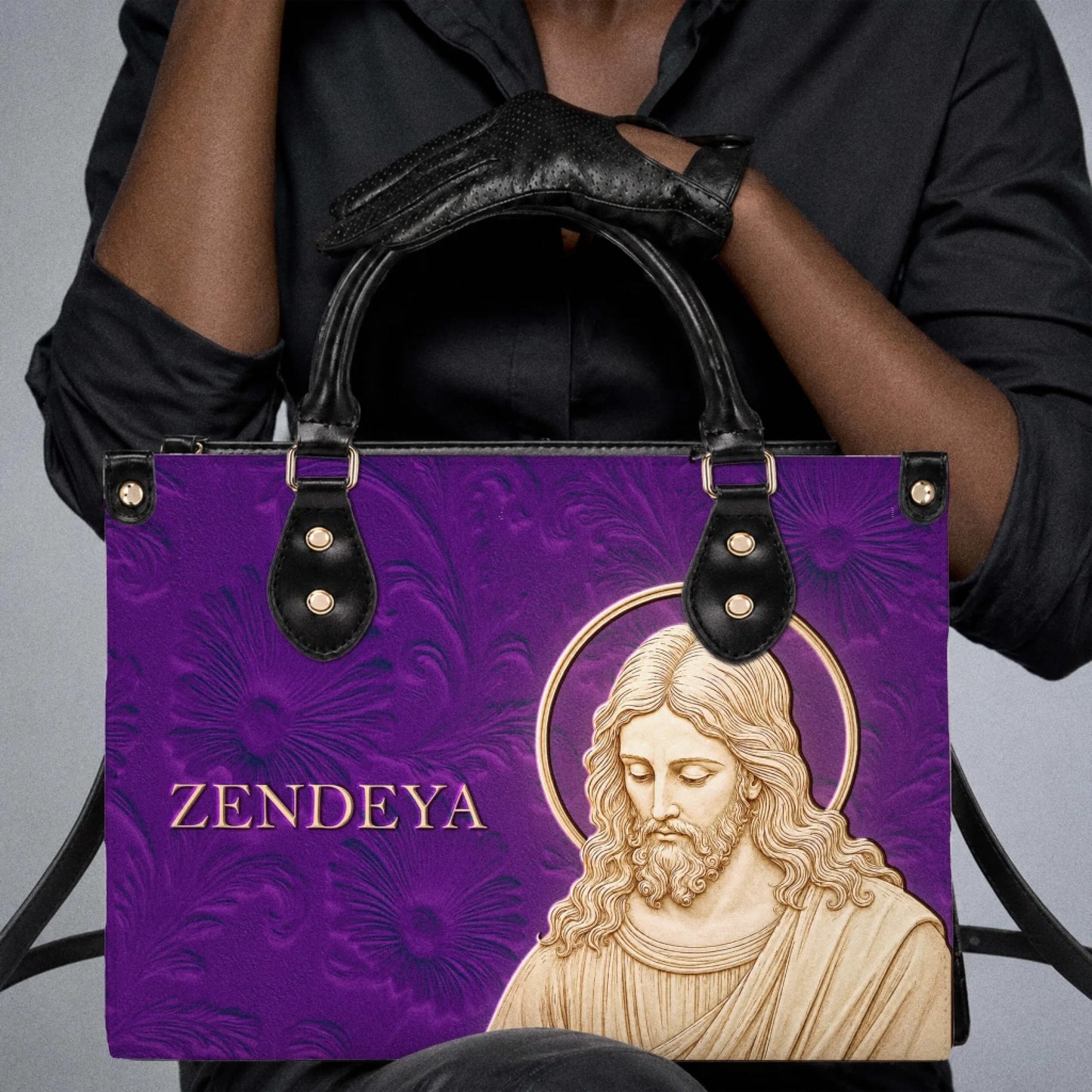Custom religious handbag in purple featuring a Jesus portrait and the name Zendeya for a stylish everyday bag.