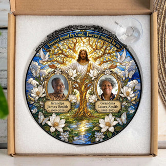 Acrylic memorial suncatcher in packaging, showcasing Jesus, a tree, and personalized photos with commemorative dates.