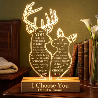 Custom deer-shaped acrylic lamp with a wooden base, engraved with romantic text and couple names for home decor.