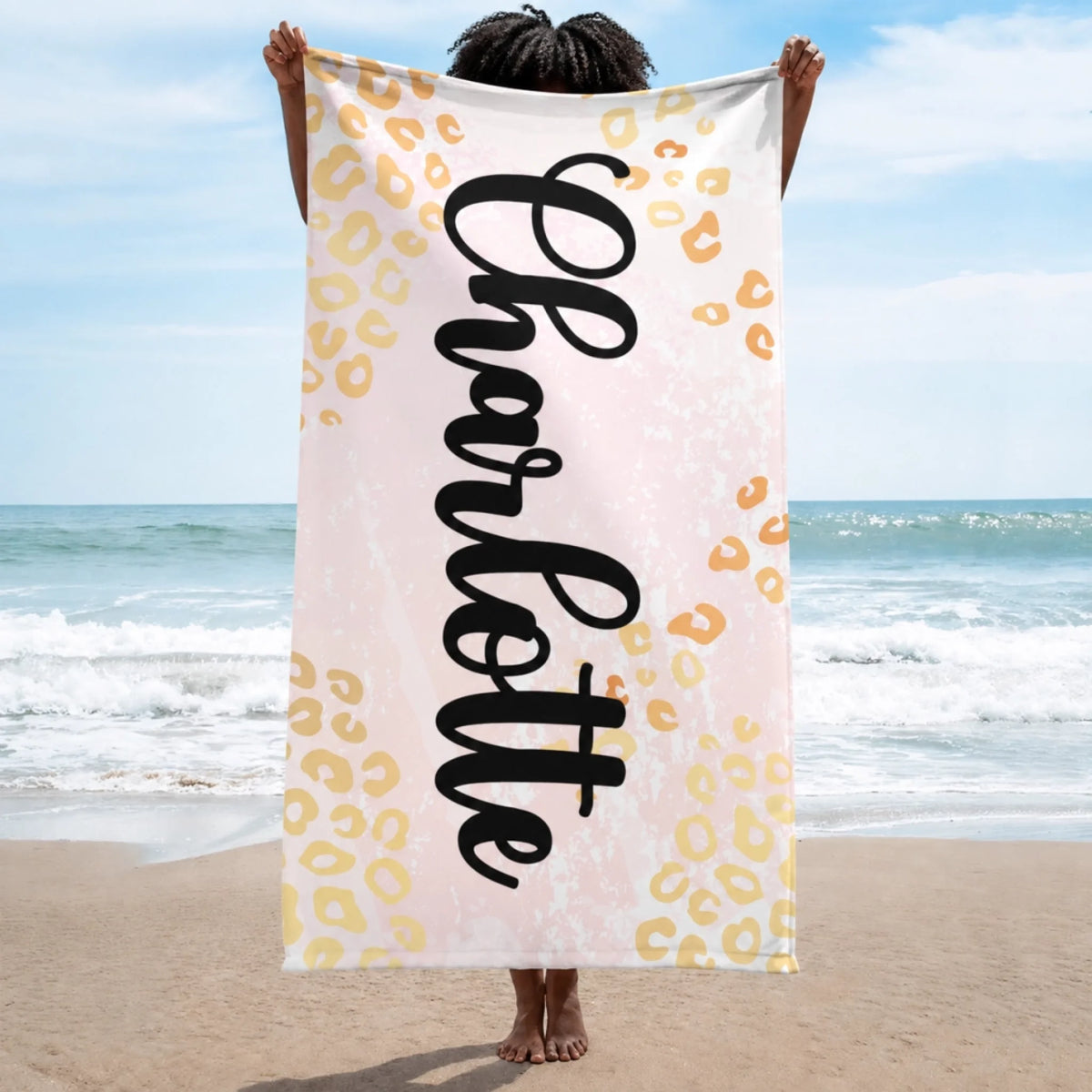 Personalized beach towel for Charlotte featuring a trendy light pink leopard print design for summer vacation trips.