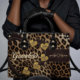 A personalized leopard print handbag for grandma featuring a heart design with custom names and heartbeat graphics.