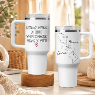 Set of two white tumblers with handles featuring custom US state maps and long distance relationship quotes for couples.