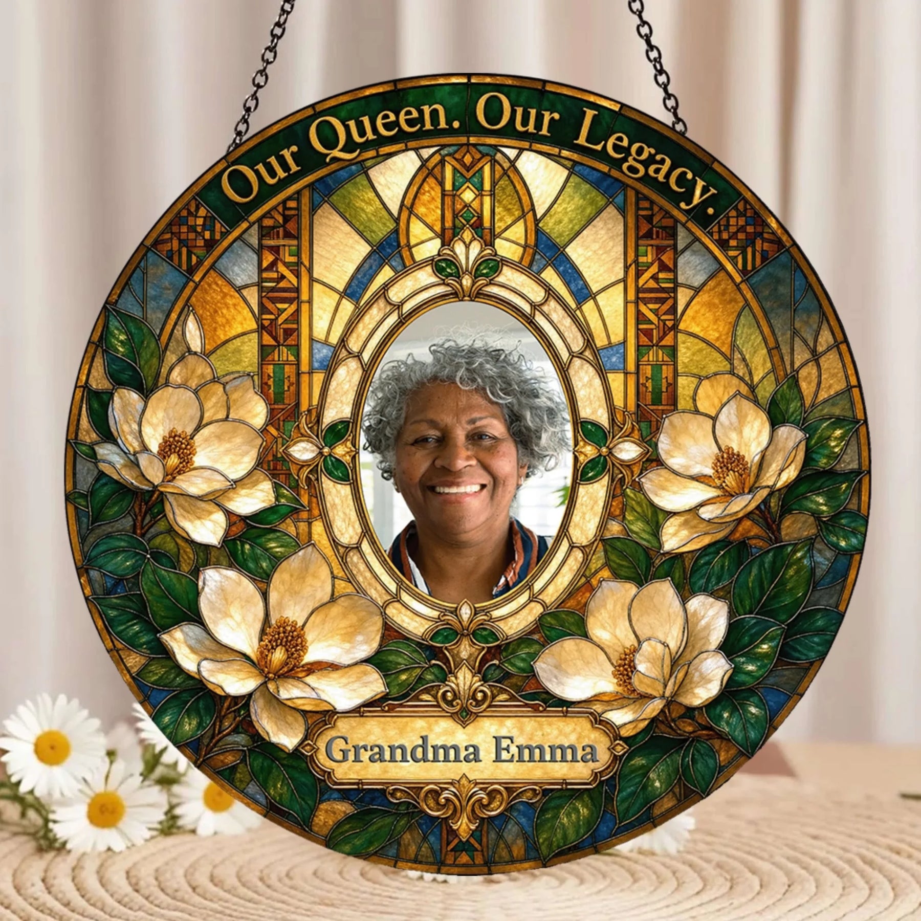 Stained glass style memorial suncatcher for Grandma with custom photo and floral artwork hanging by a chain.
