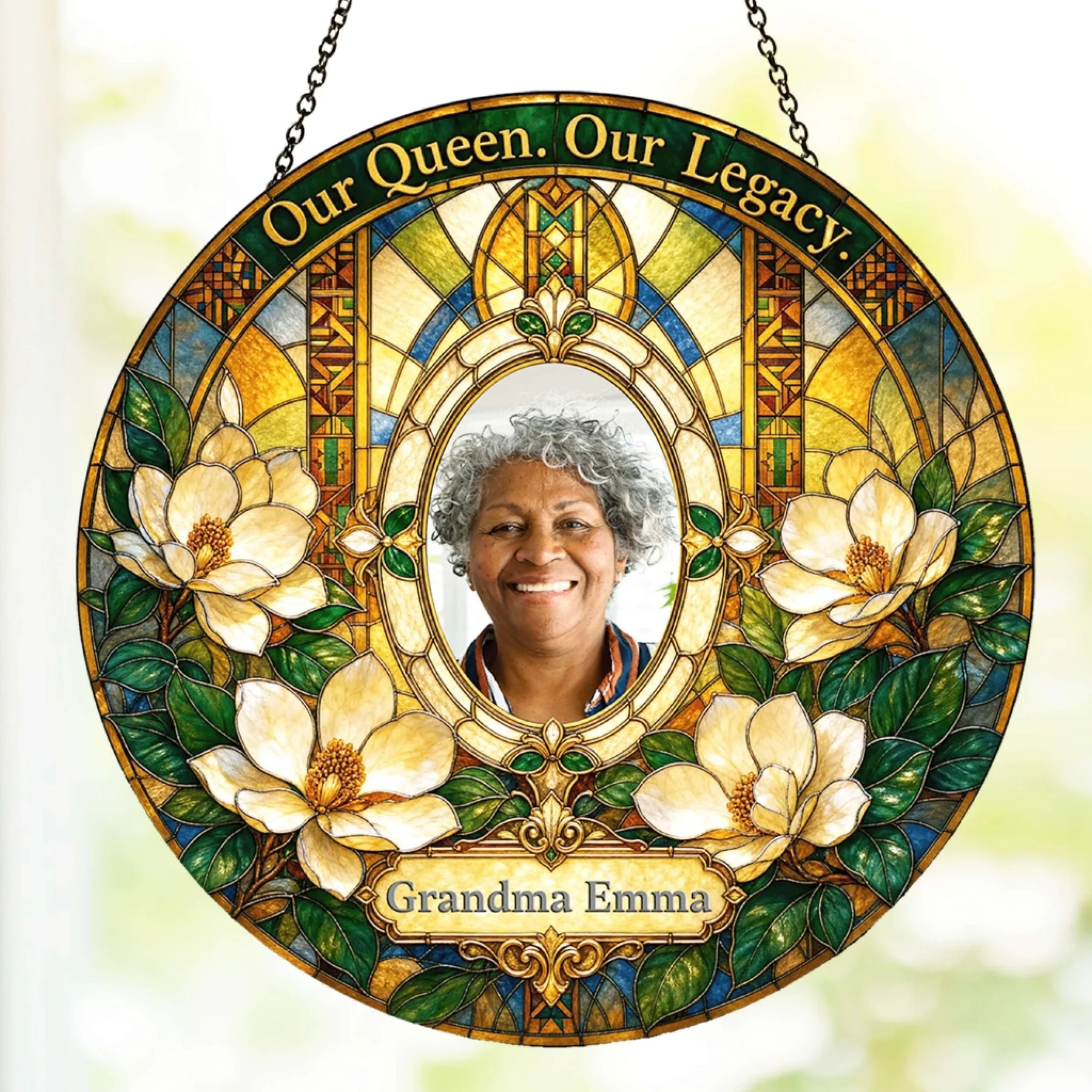 Custom grandma memorial suncatcher featuring a photo and magnolia flowers with the text Our Queen Our Legacy.