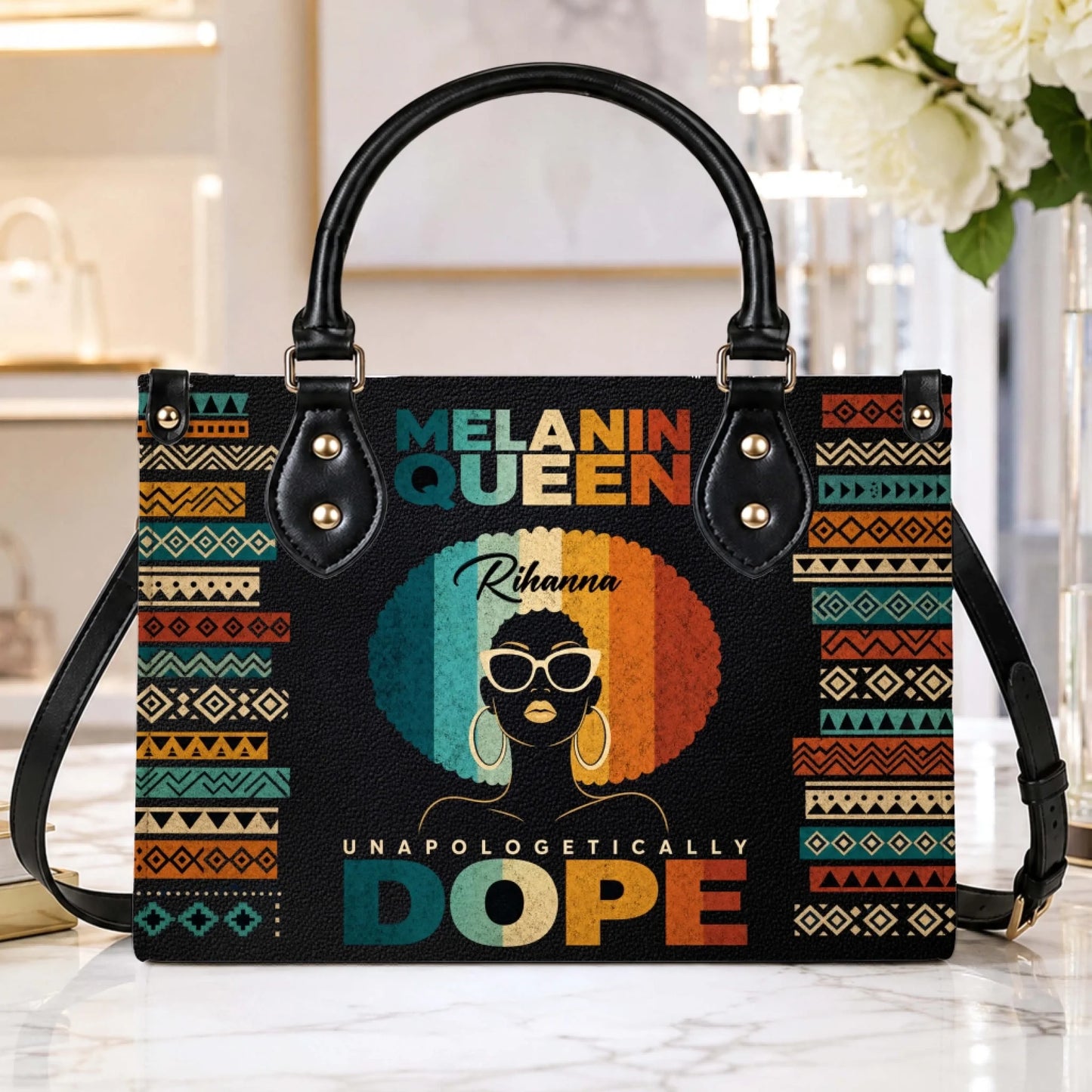 Stylish Melanin Queen PU leather handbag with retro Afro art and custom name, displayed on a marble surface.