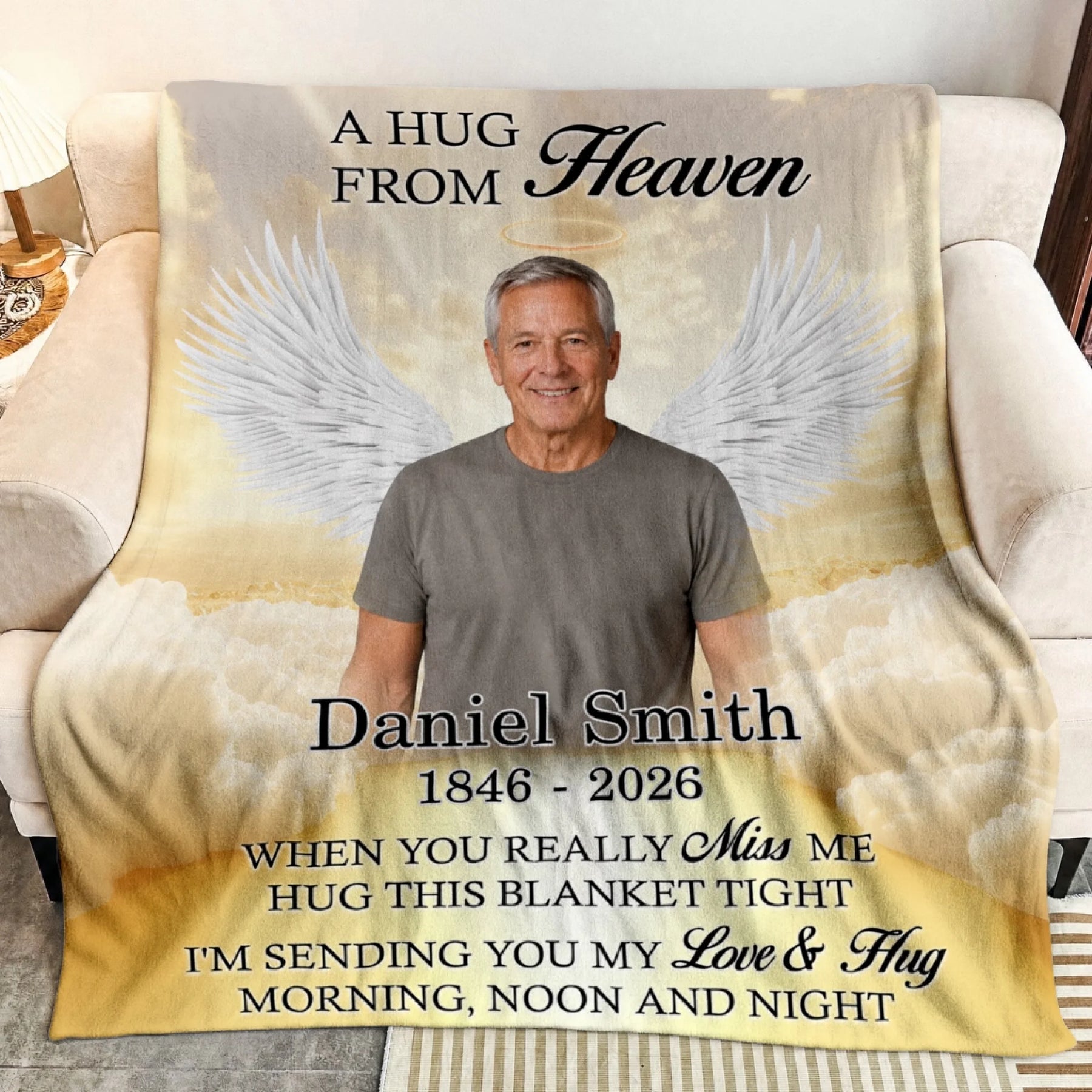 Custom memorial fleece blanket featuring a photo of a man with angel wings and the text A Hug From Heaven for sympathy.