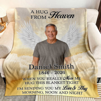 Custom memorial fleece blanket featuring a photo of a man with angel wings and the text A Hug From Heaven for sympathy.