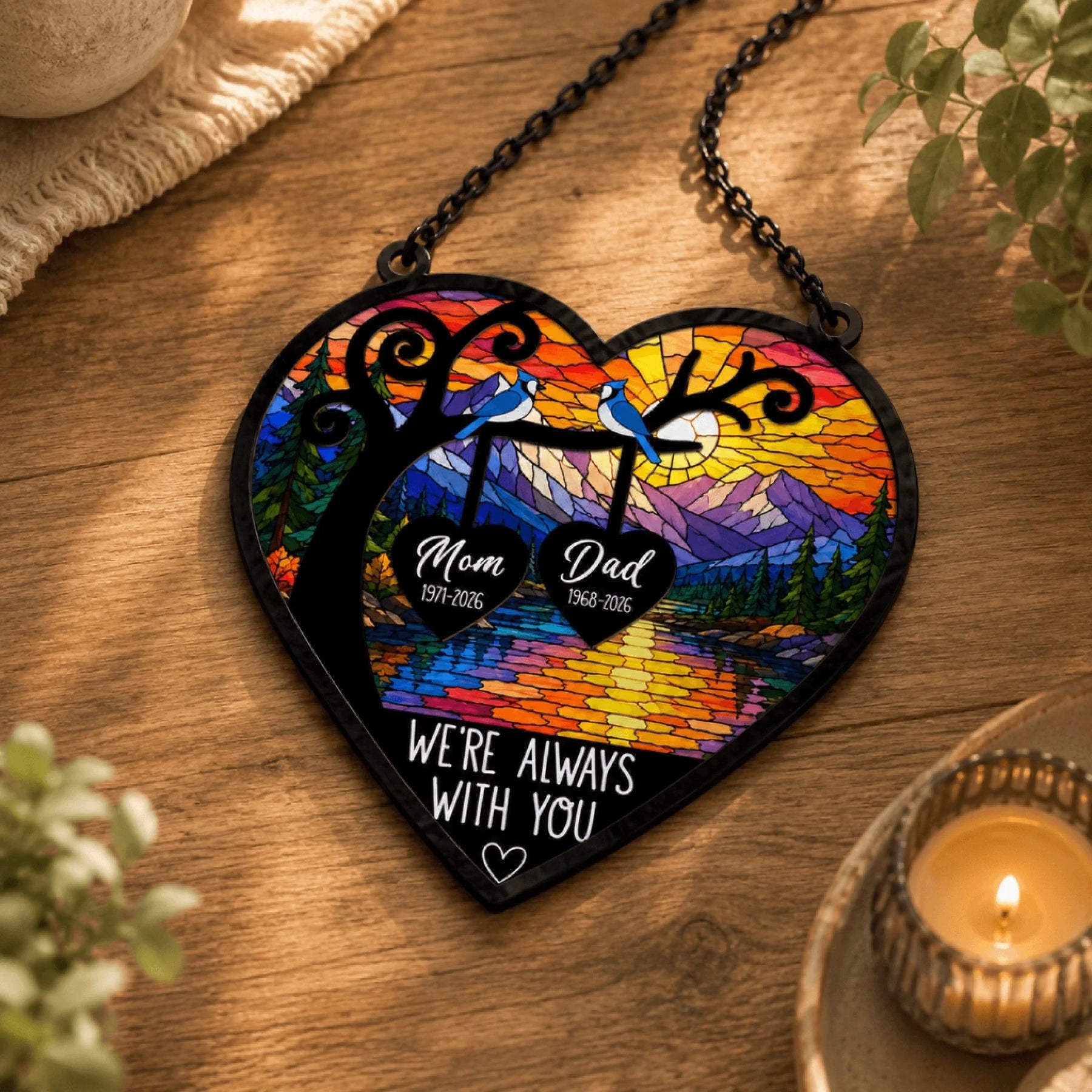 Personalized memorial stained glass heart hanging with two blue jays and lake landscape, custom sympathy gift for loss of parents.