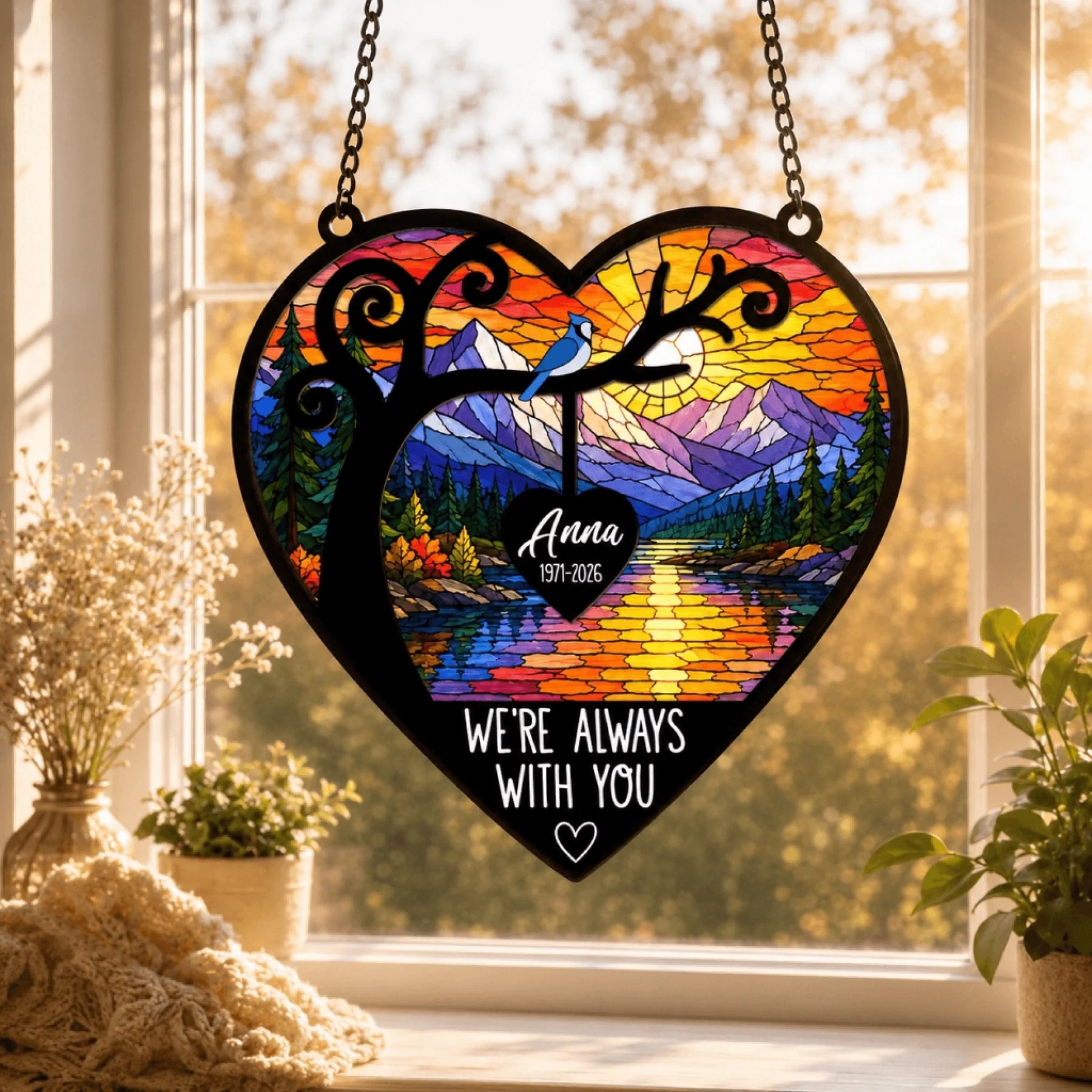 Personalized memorial stained glass heart suncatcher featuring a nature landscape, blue jay, custom name and dates for sympathy gift.