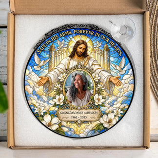 Personalized memorial suncatcher featuring a portrait of a loved one, Jesus, and custom dates in a gift box.