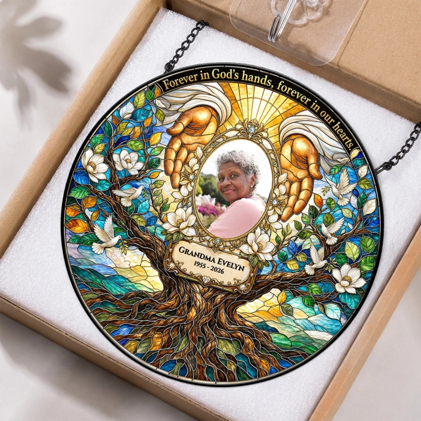 Custom Grandma Evelyn memorial suncatcher featuring angel hands and dove design inside protective packaging box.