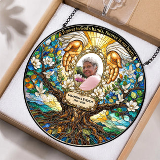 Custom Grandma Evelyn memorial suncatcher featuring angel hands and dove design inside protective packaging box.