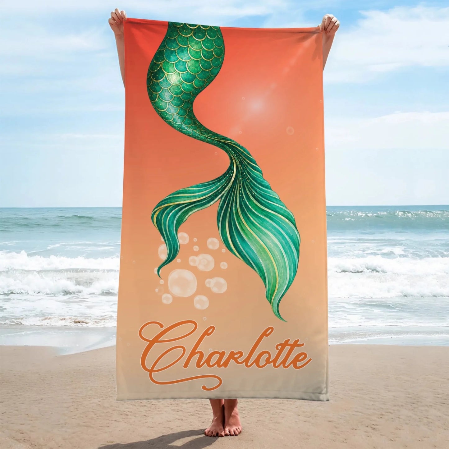 Custom mermaid tail beach towel featuring the name Charlotte on a vibrant orange ombre background for summer beach days.