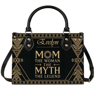 Black and gold personalized handbag for mom featuring the quote The Woman The Myth The Legend and custom name Evelyn.