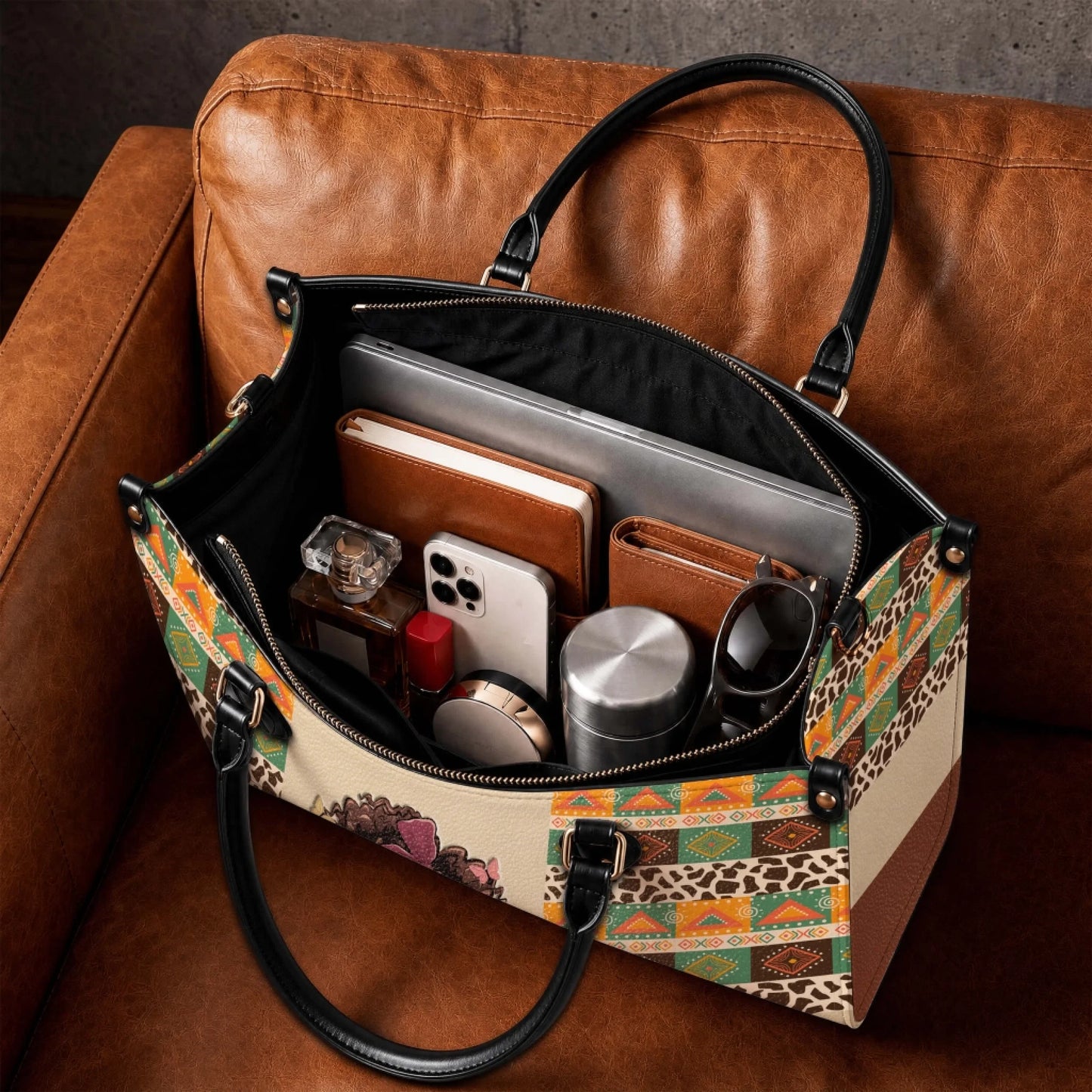 Spacious personalized tote bag for mom featuring an ethnic boho design, gold hardware, and organized internal laptop compartment.
