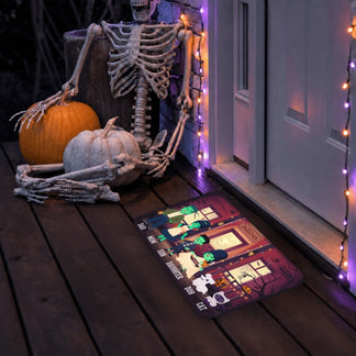Halloween porch floor mat featuring a personalized monster family cartoon design with labels for every family member and pet.