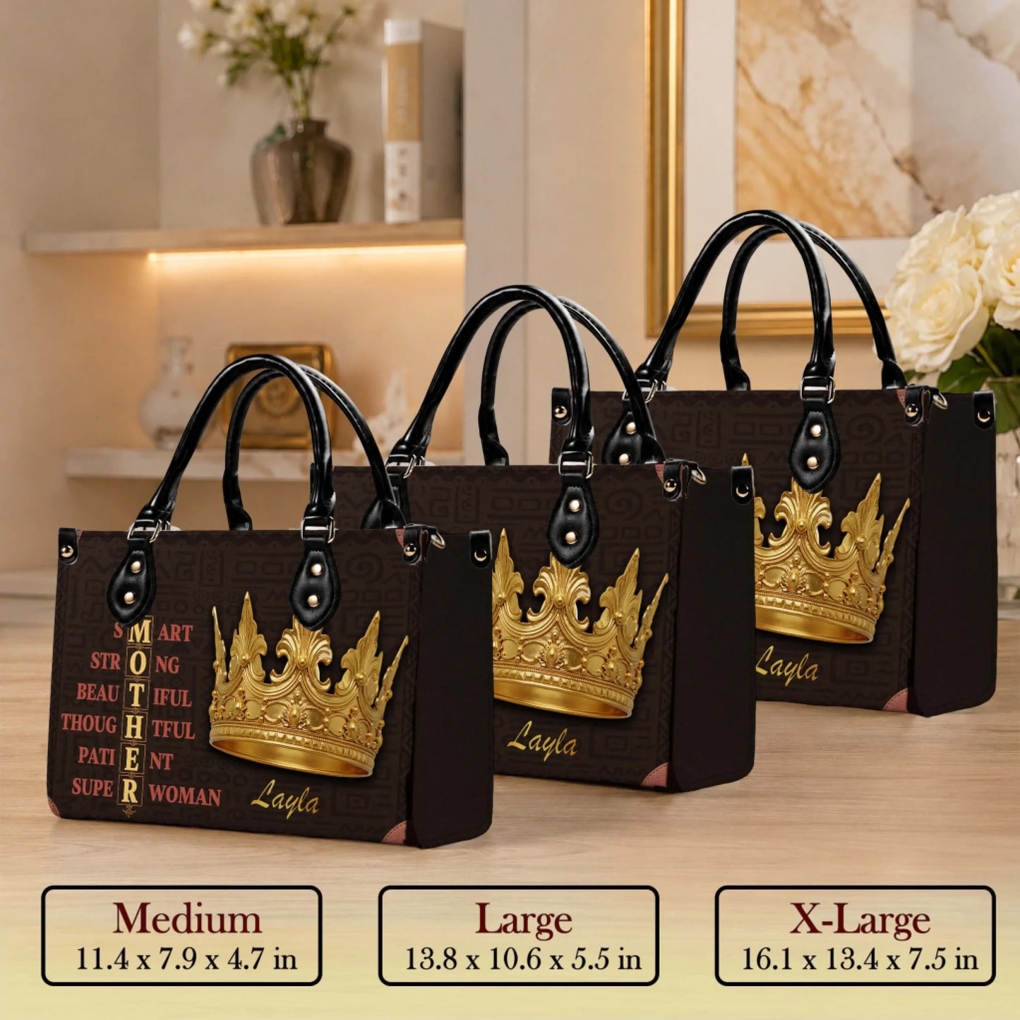 Three sizes of personalized Layla mother tote bags with golden crown design displayed on a wooden surface.