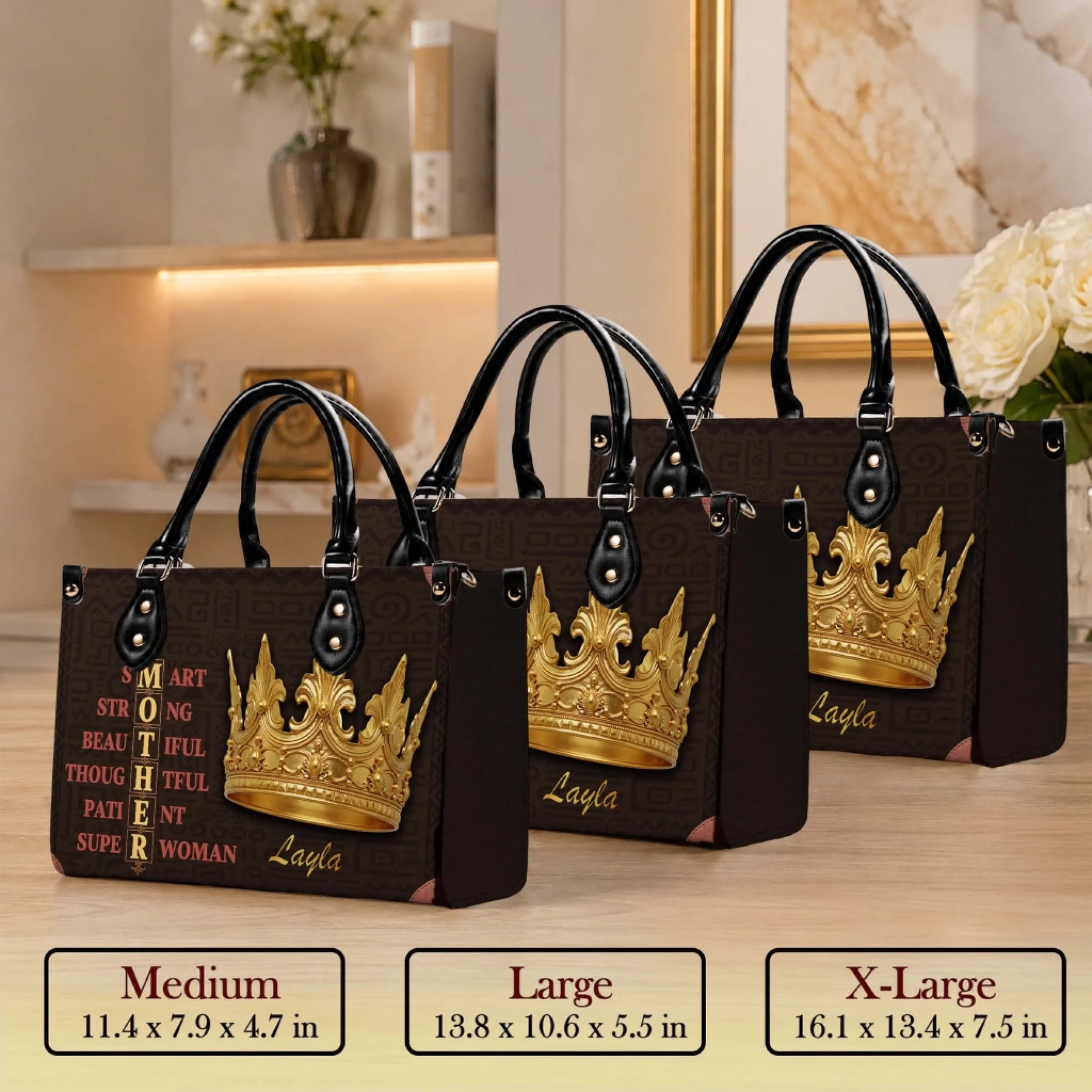 Three sizes of personalized Layla mother tote bags with golden crown design displayed on a wooden surface.