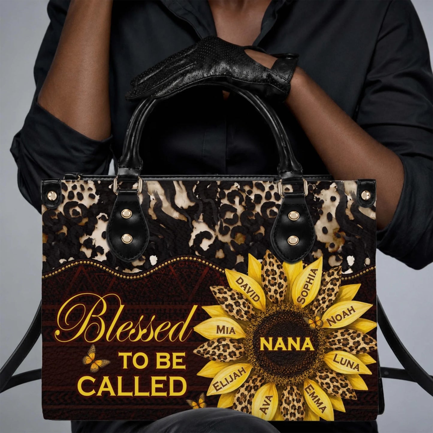 Fashionable personalized handbag featuring sunflower art, family names, and the text Blessed To Be Called Nana.