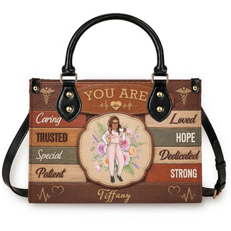 Custom nurse handbag with Tiffany name featuring a floral design and stethoscope icons perfect for nurse appreciation gift.