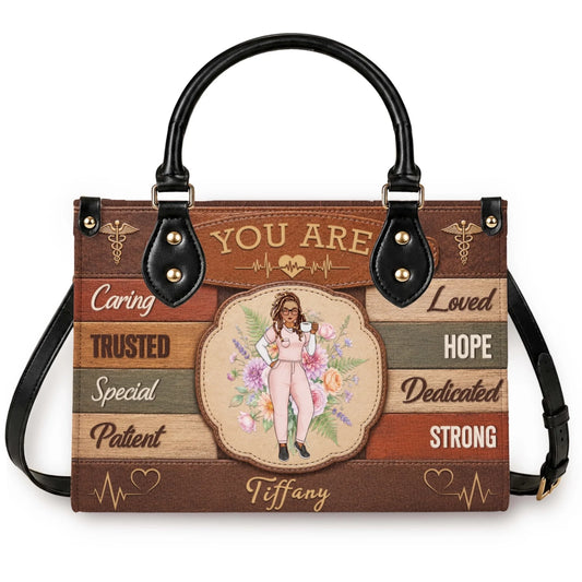 Custom nurse handbag with Tiffany name featuring a floral design and stethoscope icons perfect for nurse appreciation gift.