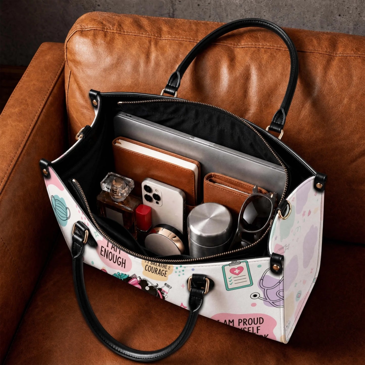 Personalized nurse life tote bag showing interior space with a laptop notebook wallet phone and metal water bottle